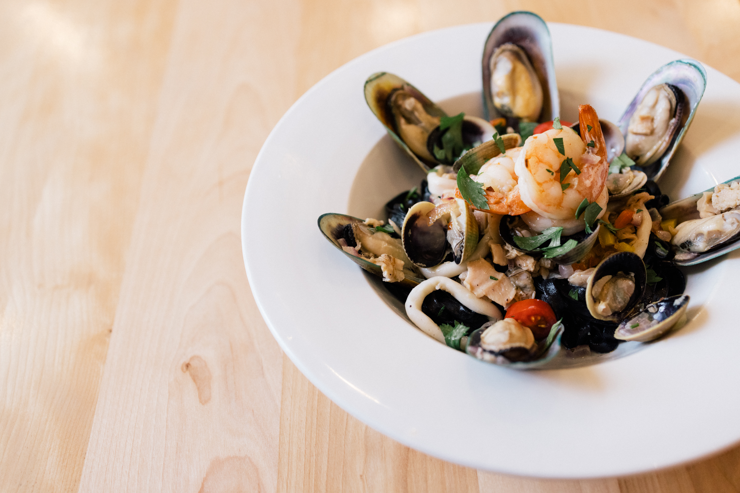 Black squid-ink pasta with clams and shrimp